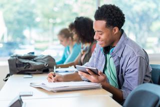 students writing in class